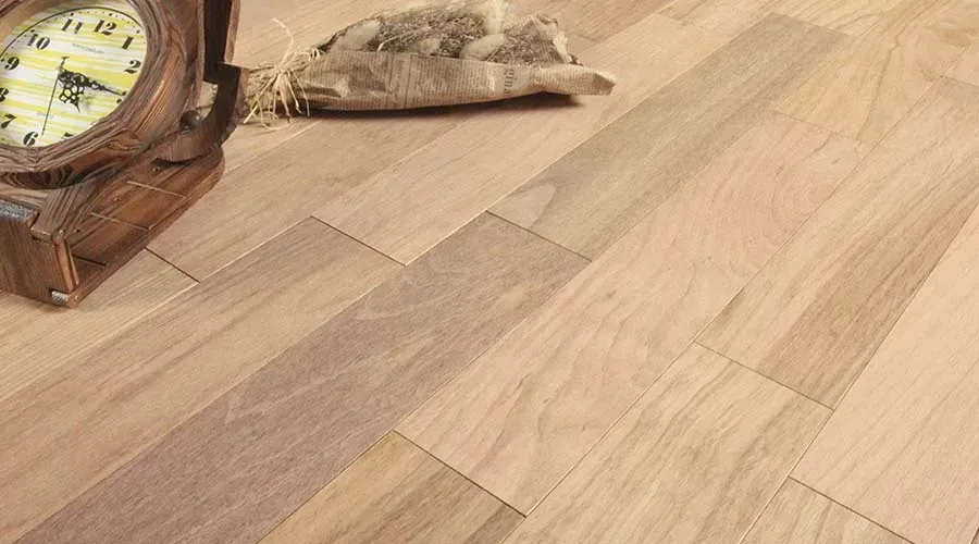 Wooden floorboards with a vintage clock and burlap sack.