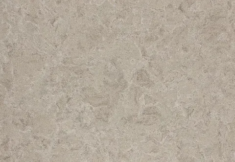 Tan-colored quartz countertop with mottled texture and slight color variations.