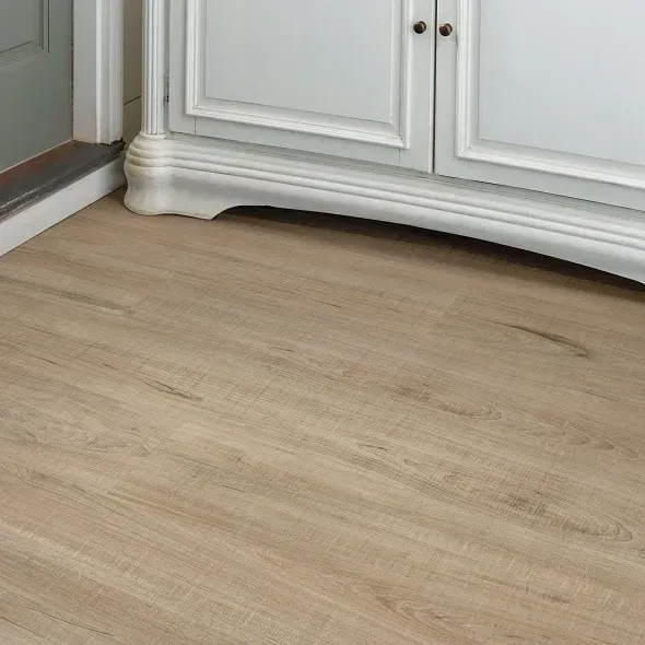 Light wood-look flooring next to a white cabinet.