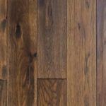 Brown hardwood floor planks, varying shades of brown and natural wood grain.