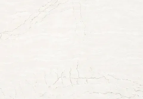Off-white marble surface with subtle light gray veins and cracks.