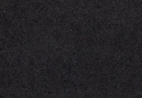 Dark, textured surface with subtle speckles.