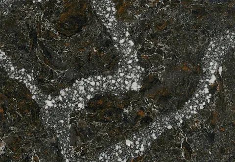 Dark gray marbled stone surface with white and brown veining.
