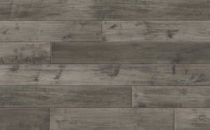 Gray wooden floorboards with distressed markings.