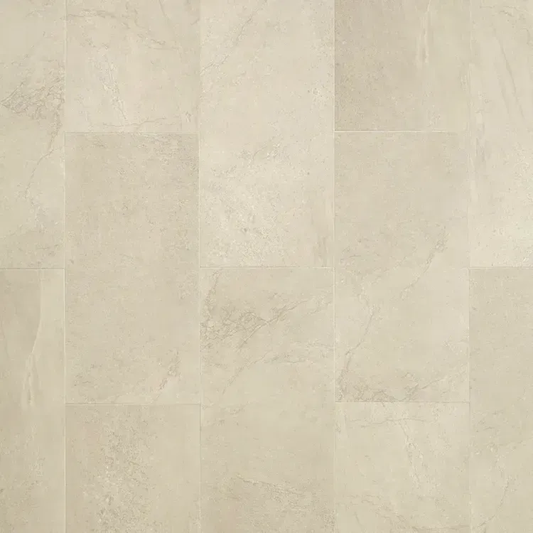 Light beige stone flooring with varying patterns and textures.