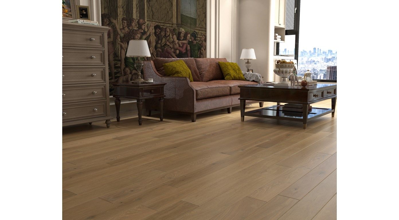 Living room with hardwood floors, sofa, tables, and artwork, natural light.