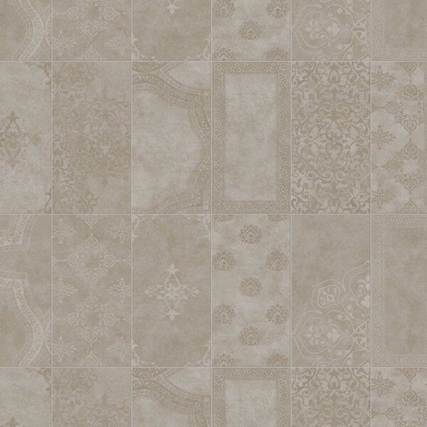 Tan-colored tiled surface with various ornate patterns, creating a patchwork design.