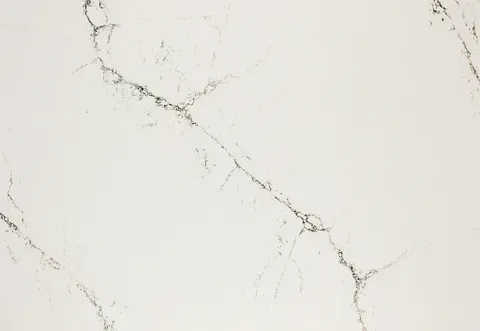 Off-white countertop with dark gray veining, resembling marble.