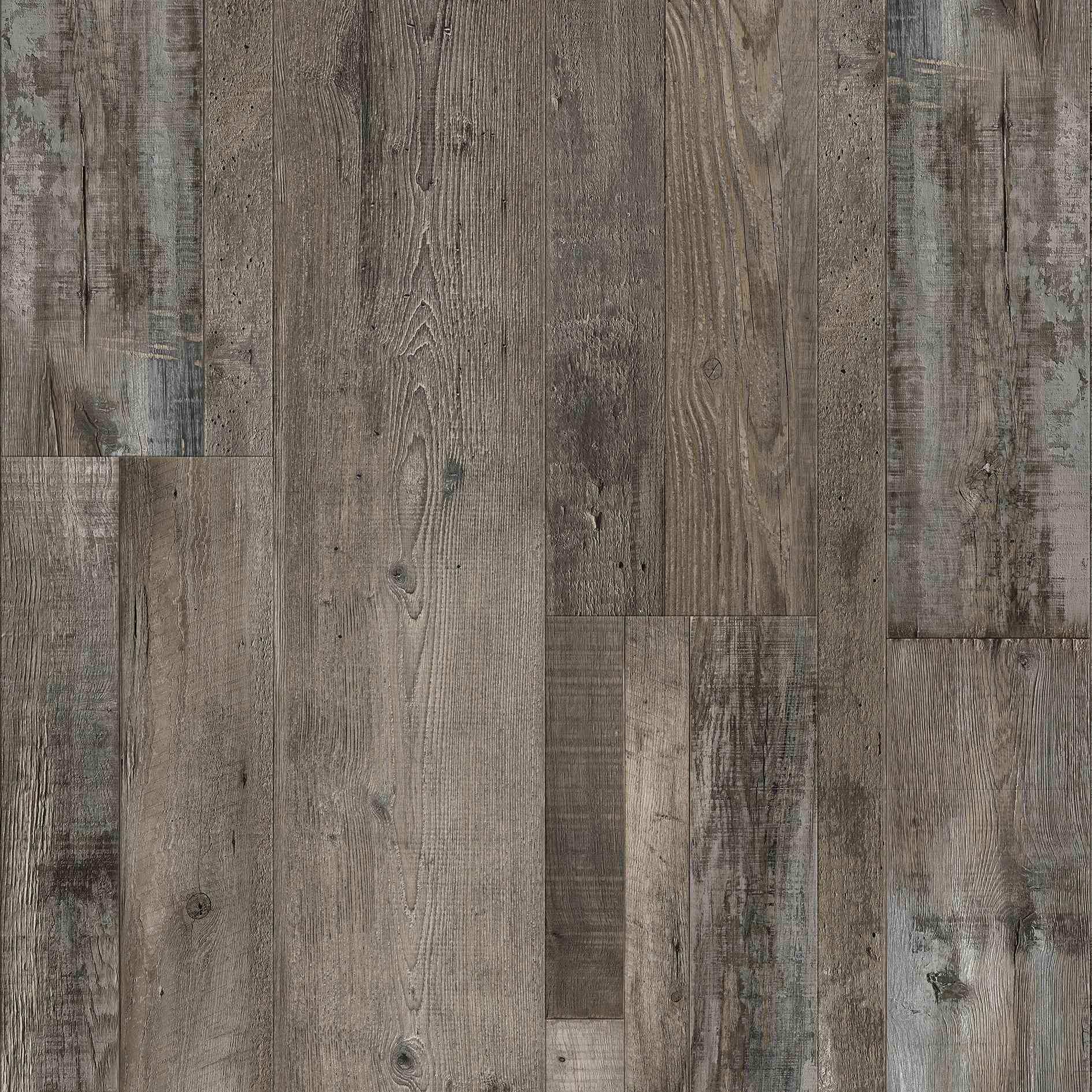 Gray and brown wood floor with a weathered and textured appearance.