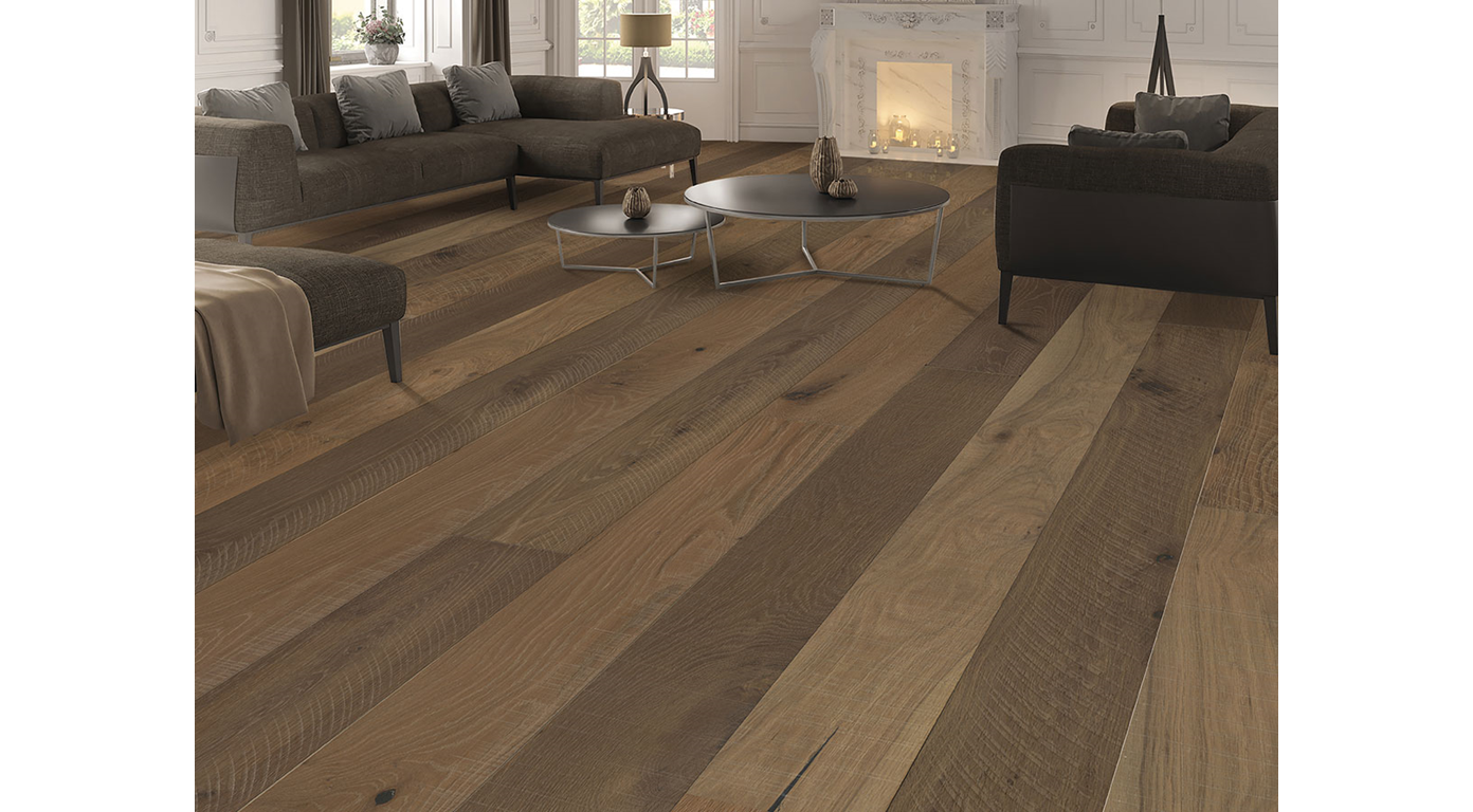 Hardwood floor in a living room with furniture, fireplace, and coffee table.