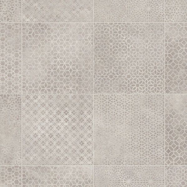 Gray floor tiles with various geometric patterns, creating a textured design.