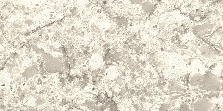Close-up of a light beige and gray speckled stone surface.