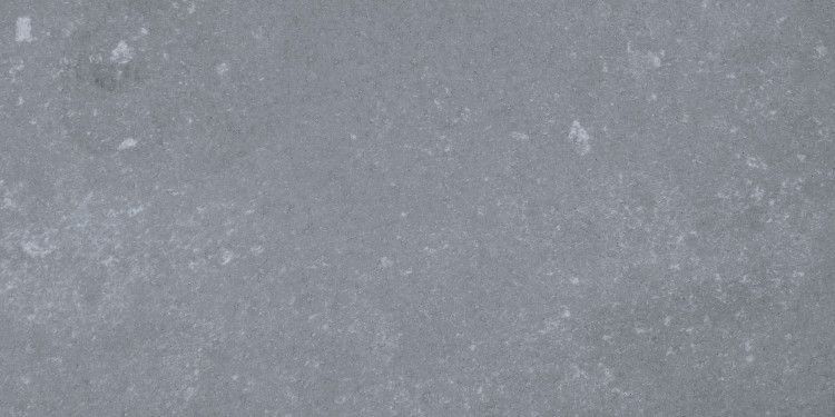 Gray concrete surface with subtle texture and imperfections.