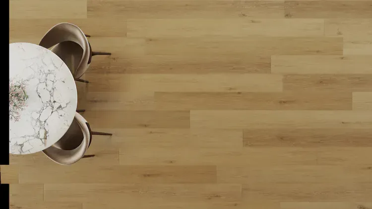 Overhead view of a round marble table with two chairs on light brown wood flooring.