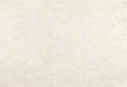 Light beige stone surface with subtle, mottled texture.