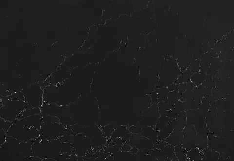 Black surface with fine, bright cracks.