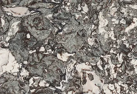Close-up of granite with a swirling pattern of black, gray, and white.