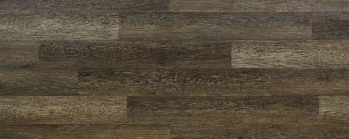 Close-up of weathered, dark wood plank flooring, arranged in a staggered pattern.