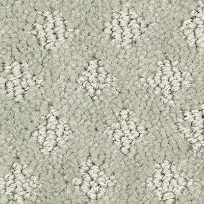 Light green carpet with diamond-shaped, off-white floral patterns.