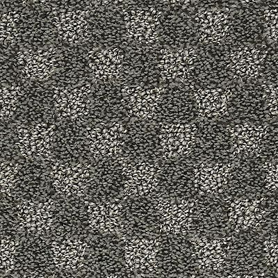 Close-up of a checkered carpet pattern in shades of gray and white.