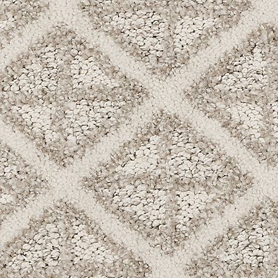 Beige carpet with diamond pattern in lighter and darker shades.