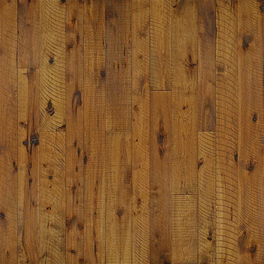 Close-up of distressed, brown wood floor with knots and vertical grain.