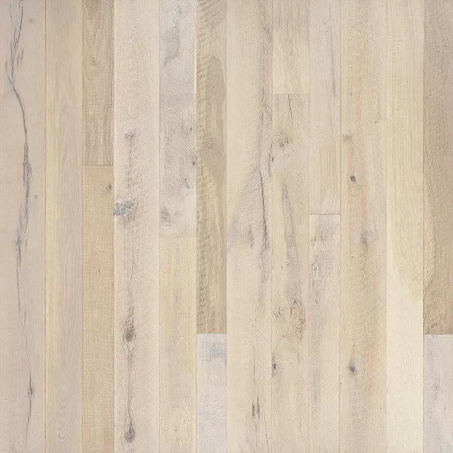 Light-colored, wide-plank wood flooring with subtle variations in color and grain.