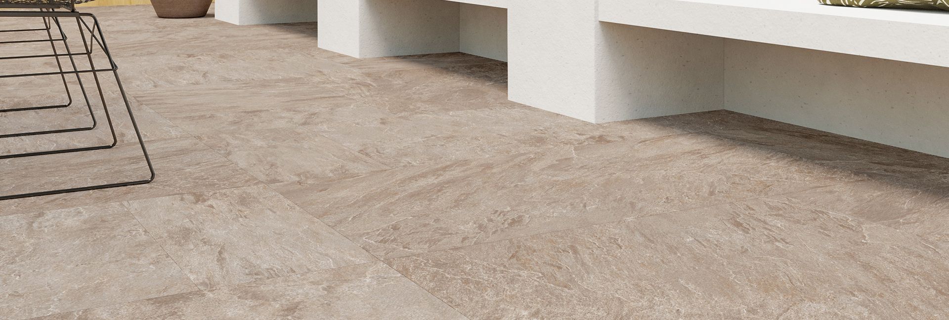 Beige stone floor with white shelving.