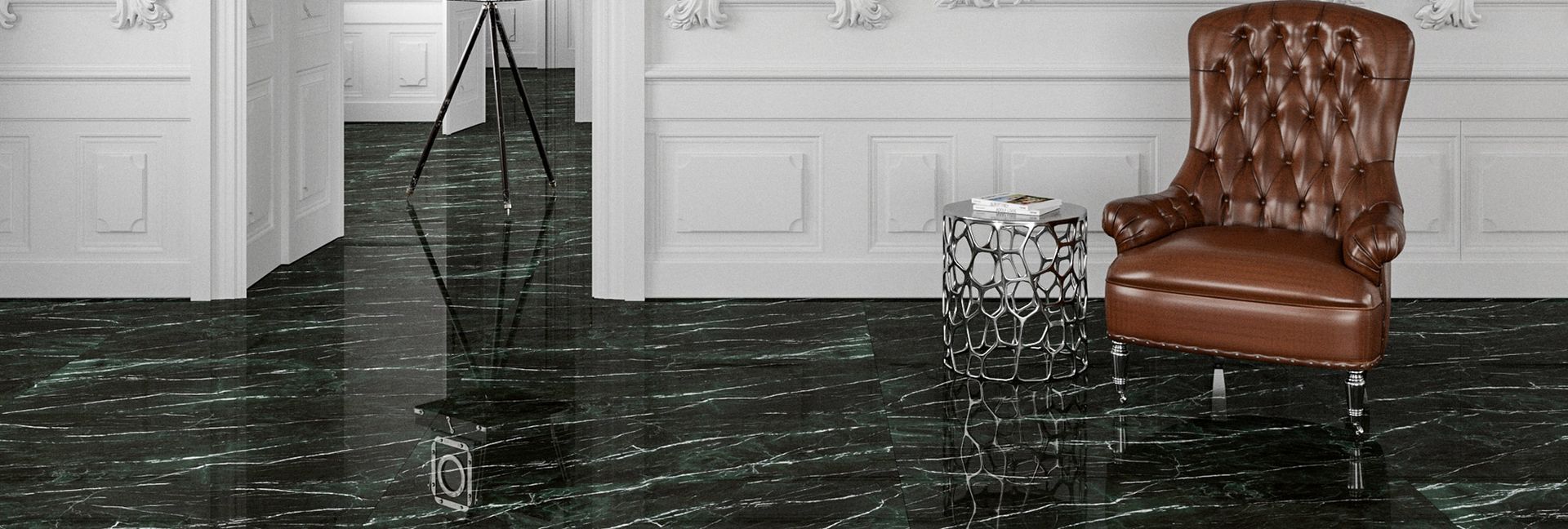 A brown leather armchair sits on a shiny black floor near a small table in a white room.