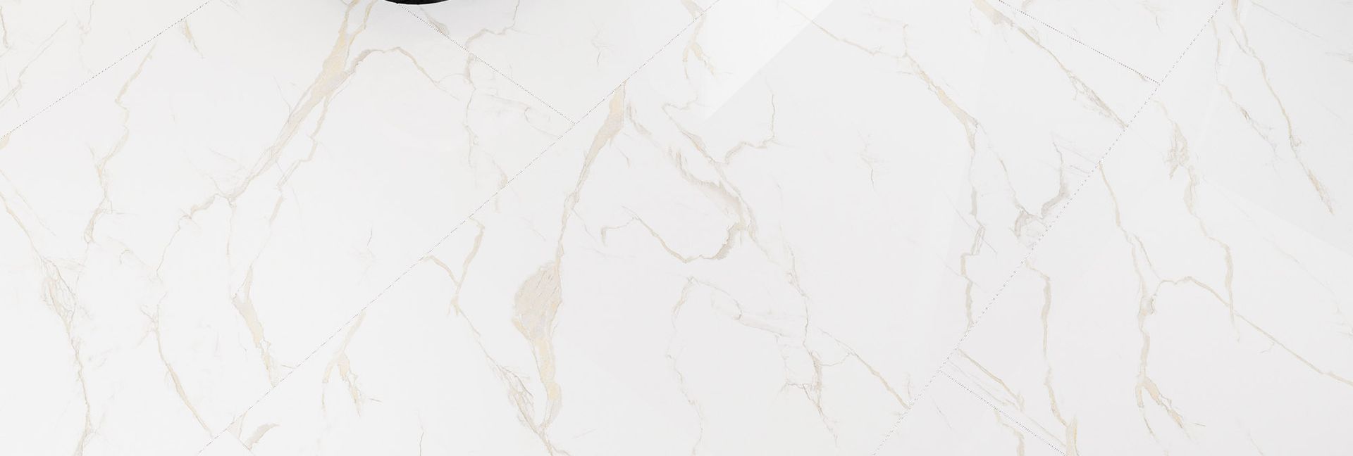 White marble with subtle beige veining.