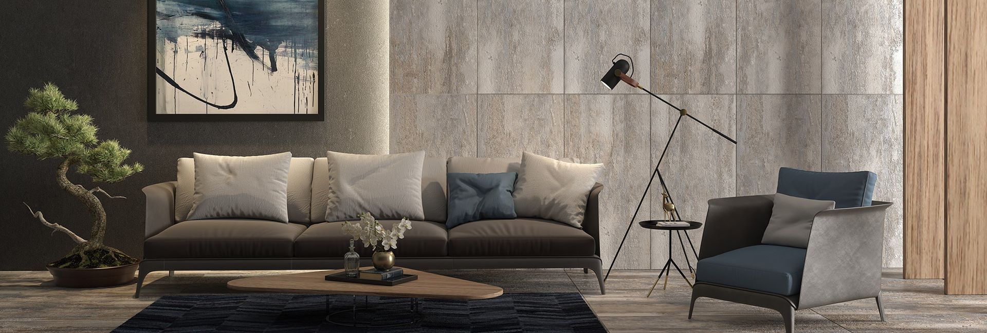 Modern living room with gray sofa, blue armchair, bonsai tree, and abstract art.