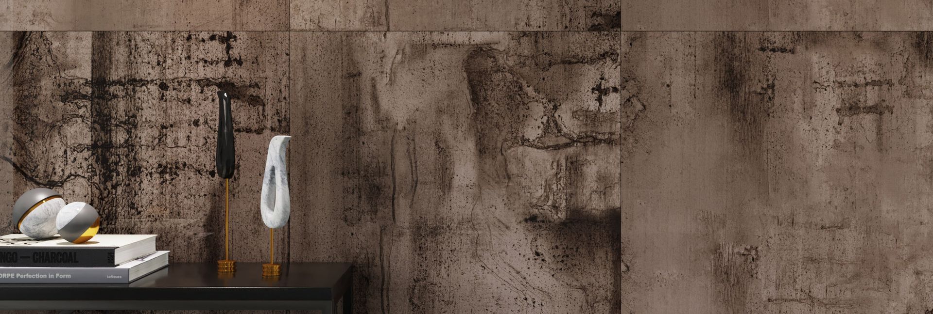 Shelf with books, decor, and weathered brown textured wall.