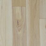 Light-colored wood floor with visible grain and knots.