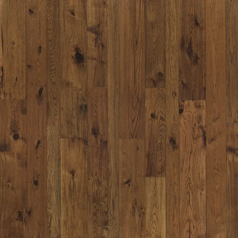 Dark brown hardwood flooring with knots and vertical wood grain.