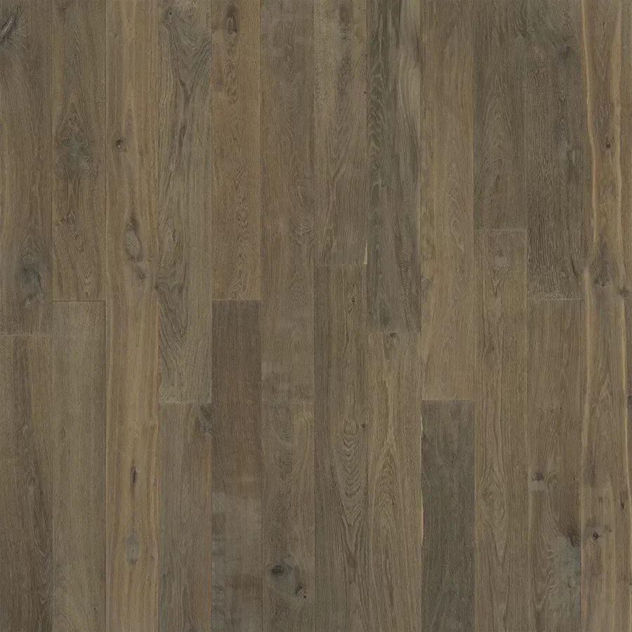 Wood flooring with various shades of brown and gray grain.