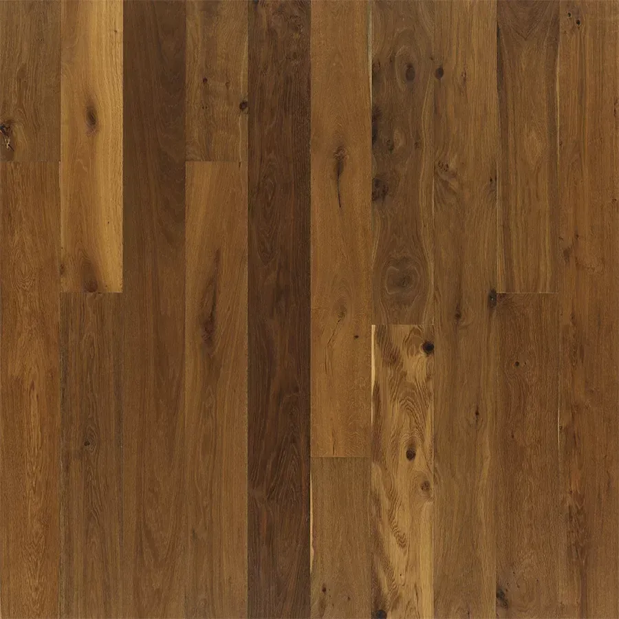 Wooden plank flooring in varying shades of brown.