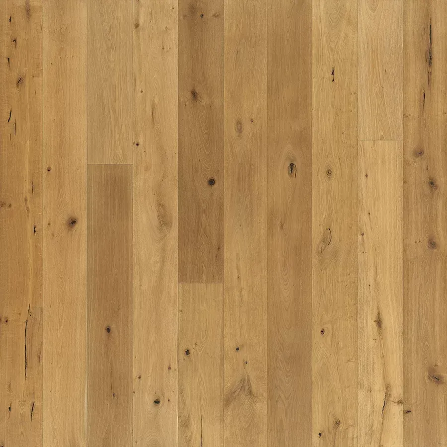 Light brown wood flooring with a natural grain pattern and occasional dark knots.
