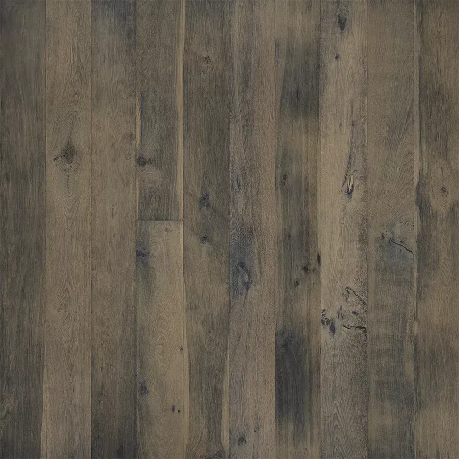 Dark gray, textured wood floorboards with natural variations in color and grain.