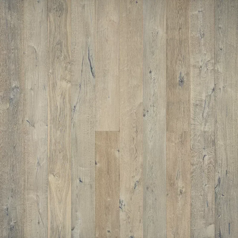 Light-toned wood floor with varying shades of beige and gray, showing natural grain and knots.