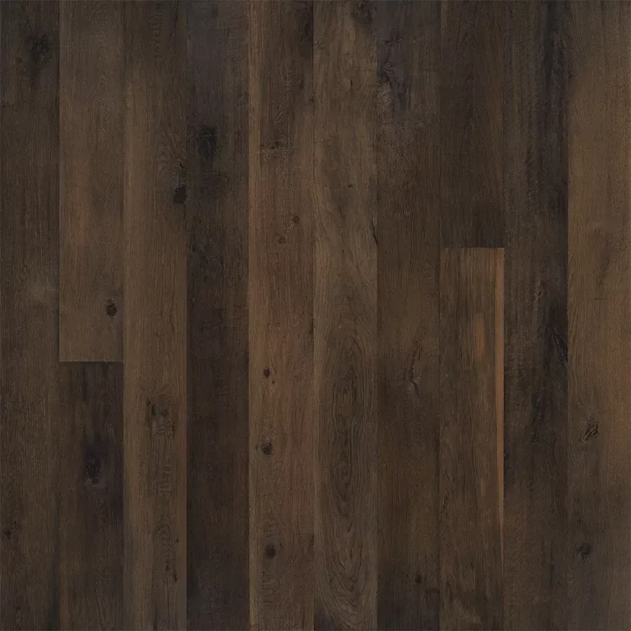 Dark brown hardwood floor planks, aged appearance.