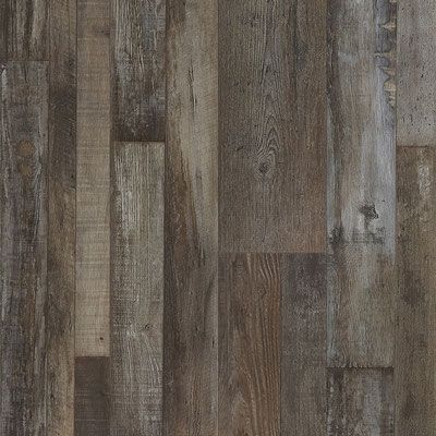 Wood-look flooring with a mix of dark brown, gray, and beige tones, mimicking aged planks.