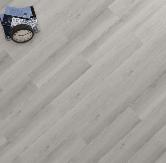 Light gray wood-look flooring with a clock and stack of papers on top.