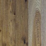 Hardwood flooring, varying shades of brown and tan.