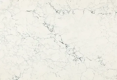 Cream-colored countertop with dark gray veining throughout, simulating marble.