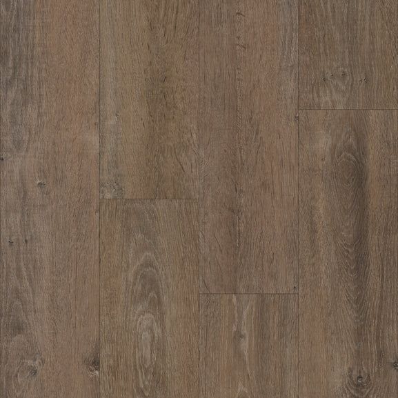 Close-up of brown wood flooring with vertical planks and visible grain.