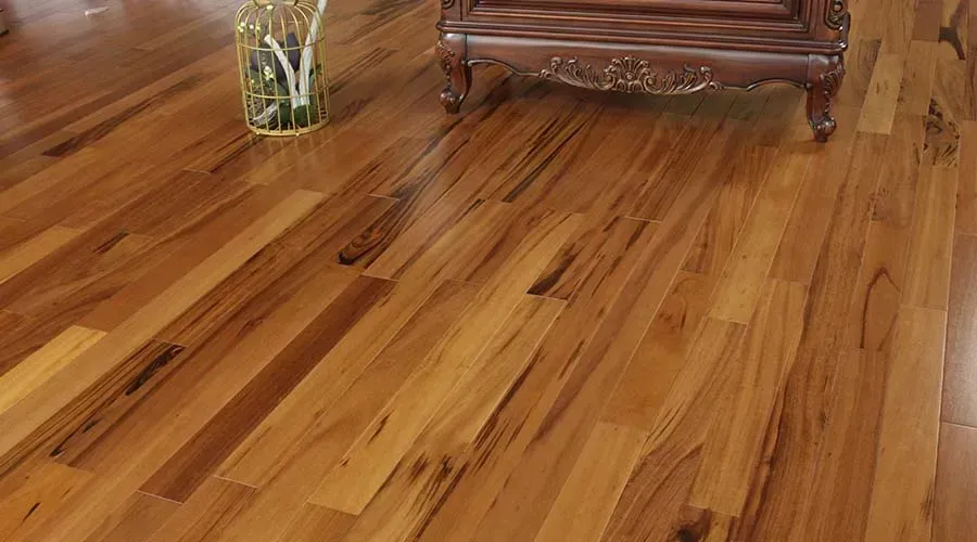 Glossy wood flooring with a decorative wooden cabinet and vase.