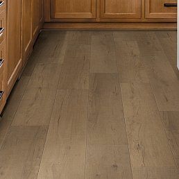 Wooden floor with a natural wood grain pattern in a kitchen setting.