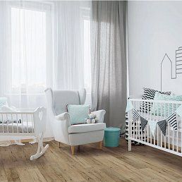 Nursery with crib, rocking chair, and light wood floor, decorated in soft blue and gray tones.