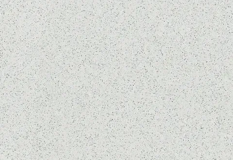 White surface speckled with small black and gray dots.