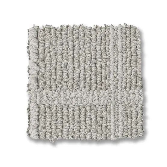 Gray carpet swatch with textured, looped fibers.